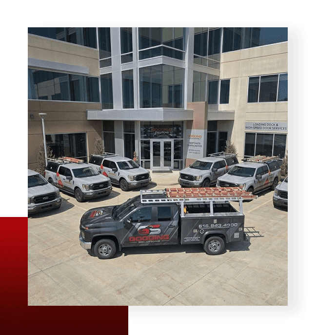 Gooding Solutions industrial door and loading dock service fleet parked outside company headquarters.